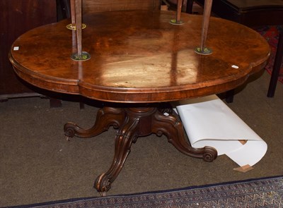 Lot 1214 - A Victorian walnut quarter veneer loo table of quatre form shape, tilt top, gardrooned column...