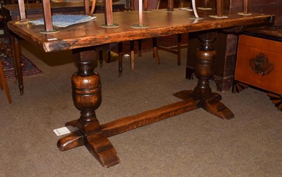 Lot 1218 - An oak refectory table, plank top with cleated ends, cup and cover supports, 167cm by 68cm by...
