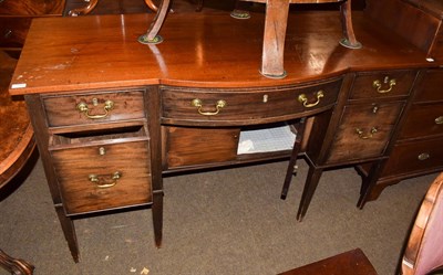 Lot 1223 - A George III bowfront sideboard the central drawer flanked by two further drawers above...