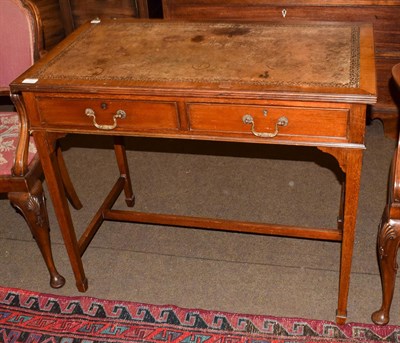 Lot 1227 - An Edwardian mahogany writing desk, brown leather inset, two drawers, square tapered legs, 91cm...