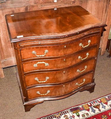Lot 1236 - A Georgian style mahogany serpentine chest of drawers, brushing slide above four long drawers,...