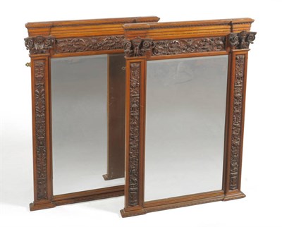 Lot 1490 - A Pair of 19th Century Italian Carved Walnut Wall Mirrors, attributed to Angelo Barbetti, one dated