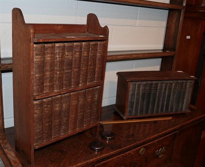 Lot 1261 - Two oak table-top bookcases, housing a set of novels by Dickens and another set by H.G.Wells