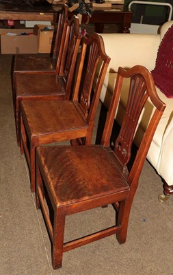 Lot 1278 - A set of four late 18th/early 19th century oak country shield-back dining chairs