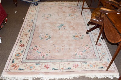 Lot 1285 - A Chinese carved carpet, the blush ivory field with floral decoration, 280cm by 186cm