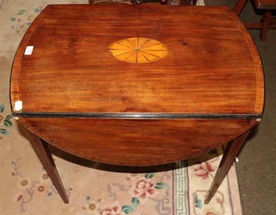 Lot 1289 - A George III mahogany and crossbanded Pembroke table, oval top with drop flaps, inlaid...