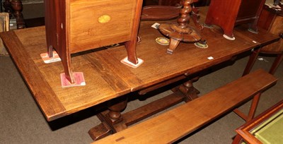 Lot 1298 - An oak extending refectory style table, twin turned supports to stretchers, 200cm (extended) by...