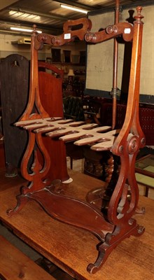 Lot 1301 - A 19th century mahogany boot-rack with lyre-form supports, 63cm by 100cm high