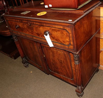 Lot 1304 - A William IV mahogany secretaire cabinet, drawer with fall flat fitted interior above twin cupboard