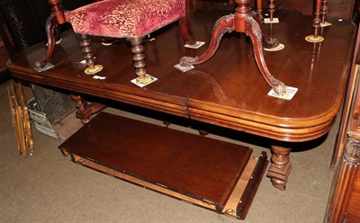 Lot 1307 - A 20th century mahogany stained extending dining table with four extra leaves, 298cm (extended)...