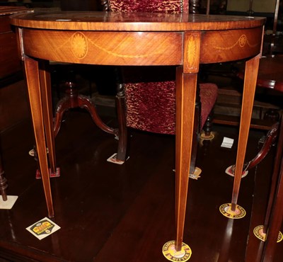 Lot 1310 - A George III style mahogany and satinwood demi-lune side table, the top with elaborate urn,...