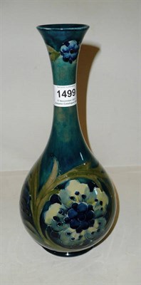 Lot 1499 - A William Moorcroft Late Florian Pattern Vase, in sage green and blues, impressed factory mark...