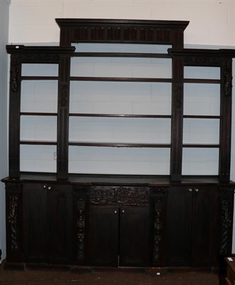 Lot 1326 - A 19th century oak bookcase, incorporating some earlier carved panels and pilasters, the upper...