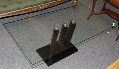 Lot 1335 - A modern glass-top coffee table, with black ash base, 119cm by 60cm by 47cm