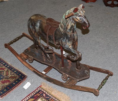 Lot 1343 - A 19th century painted push along horse together with associated mahogany rocker, 123cm long