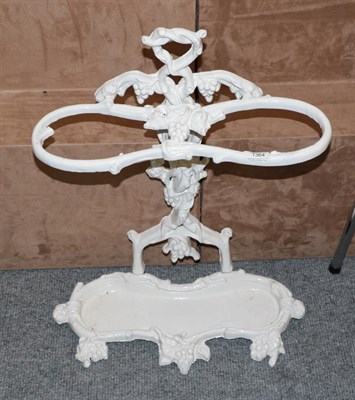 Lot 1364 - A white painted cast-iron two-division stick-stand, cast with grapes and vines, 62cm high