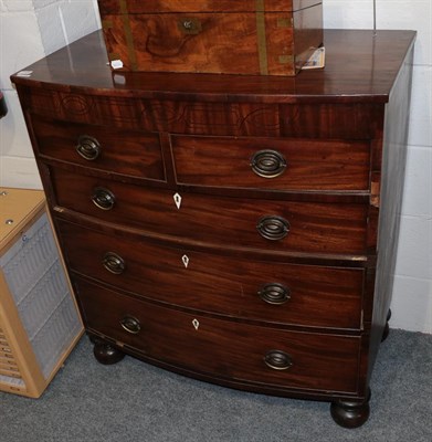 Lot 1378 - A George III mahogany bow-front four-height chest of drawers with later bun feet, 94cm by 50cm...