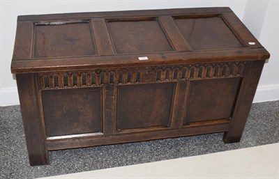 Lot 1391 - An 18th century three-panel oak coffer, 116cm by 50cm by 59cm