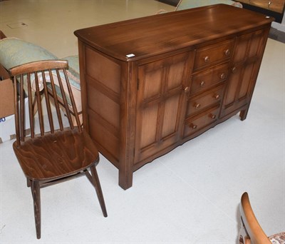 Lot 1393 - A dark elm Ercol style sideboard, 146cm by 52cm by 90cm high; together with a similar single...