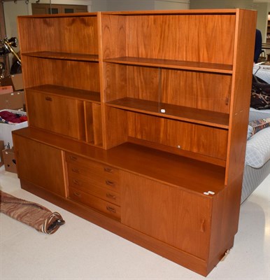 Lot 1398 - A 1970's Clausen & Son Danish teak sideboard, fitted with an arrangement of shelves, recesses, fall