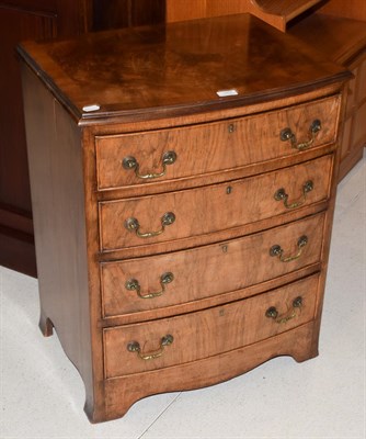 Lot 1402 - A small reproduction mahogany bow-front four-height chest of drawers, 62cm by 48cm by 75cm high