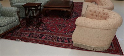 Lot 1412 - A Machine made carpet of Caucasian design, the pale camel field of stepped medallions enclosed...