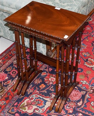 Lot 1413 - A set of three 20th century mahogany nesting tables, largest 47cm by 34cm by 68cm high