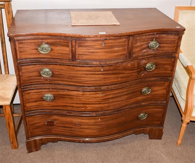 Lot 1420 - A George III serpentine fronted mahogany four-height chest of drawers, 110cm by 59cm by 96cm high