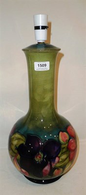 Lot 1509 - A Walter Moorcroft Clematis Pattern Lamp Base, of baluster design with elongated neck, on a...