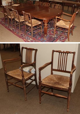 Lot 1431 - A set of twelve oak country chairs including three carvers, each with rush seats (12)