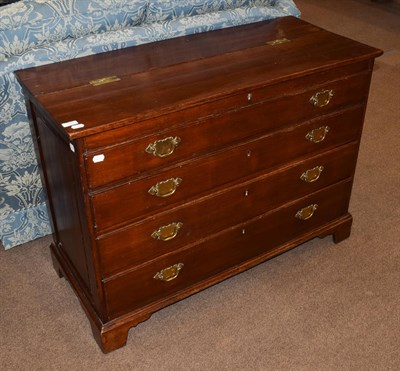 Lot 1446 - A George III oak chest of four drawers, top two dummy, hinged lid, brass swan neck handles, bracket