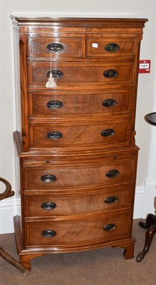 Lot 1447 - A reproduction mahogany tallboy fitted with two short over six long drawers and a dressing...