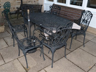 Lot 1454 - A metal garden table and set of six chairs with parasol