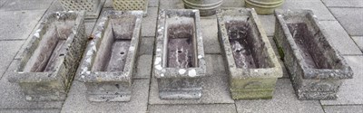 Lot 1456 - A set of five composition rectangular planters, 90cm by 33cm by 27cm high