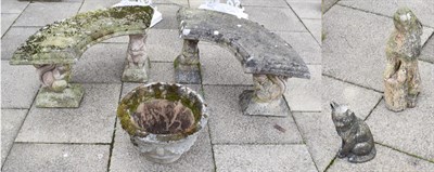 Lot 1458 - A pair of weathered composition garden benches with squirrel form legs; together with a...