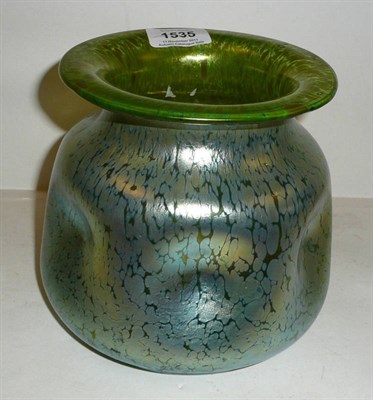 Lot 1535 - A Loetz Iridescent Glass Vase, circa 1900, green dimpled ovoid body and flared rim, with...