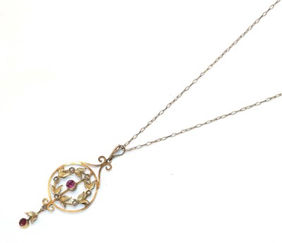 Lot 1 - An early 20th century pink stone and split pearl pendant on chain, the central round cut pink stone
