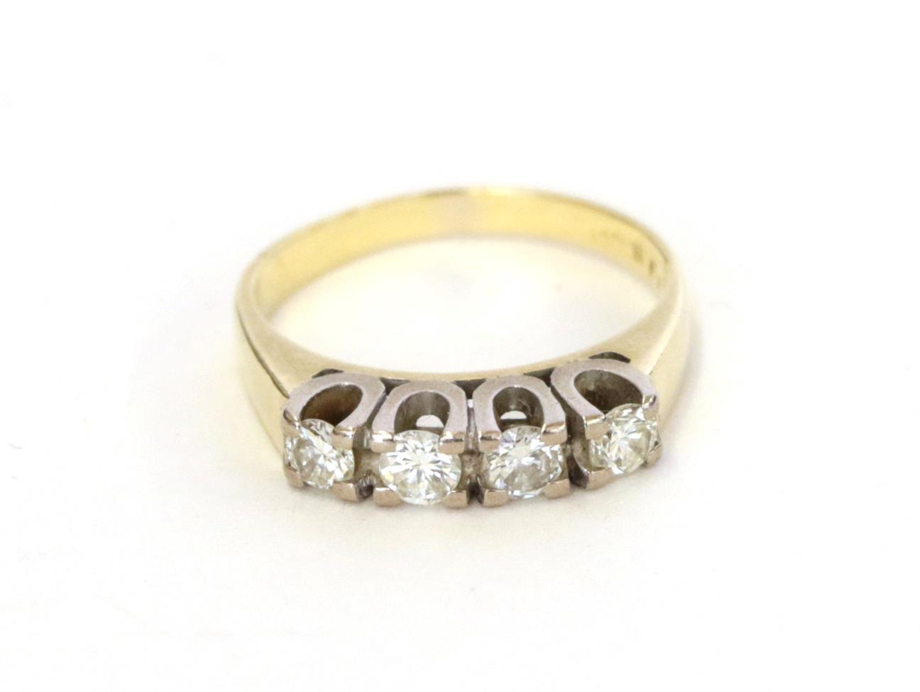 Lot 3 - A diamond four stone ring, the round brilliant cut diamonds in white claw settings, to a yellow...
