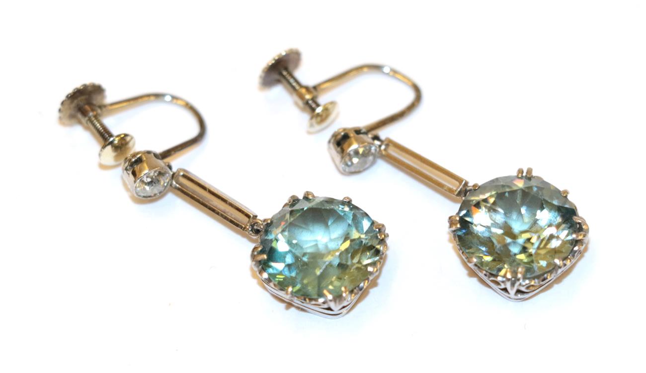 Lot 6 - This Lot Is Being Sold On Behalf Of A Charity: A pair of blue zircon and diamond drop earrings,...