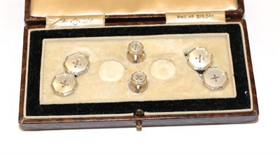 Lot 8 - A pair of mother-of-pearl cufflinks and two dress studs, of octagonal shaped button design, cased