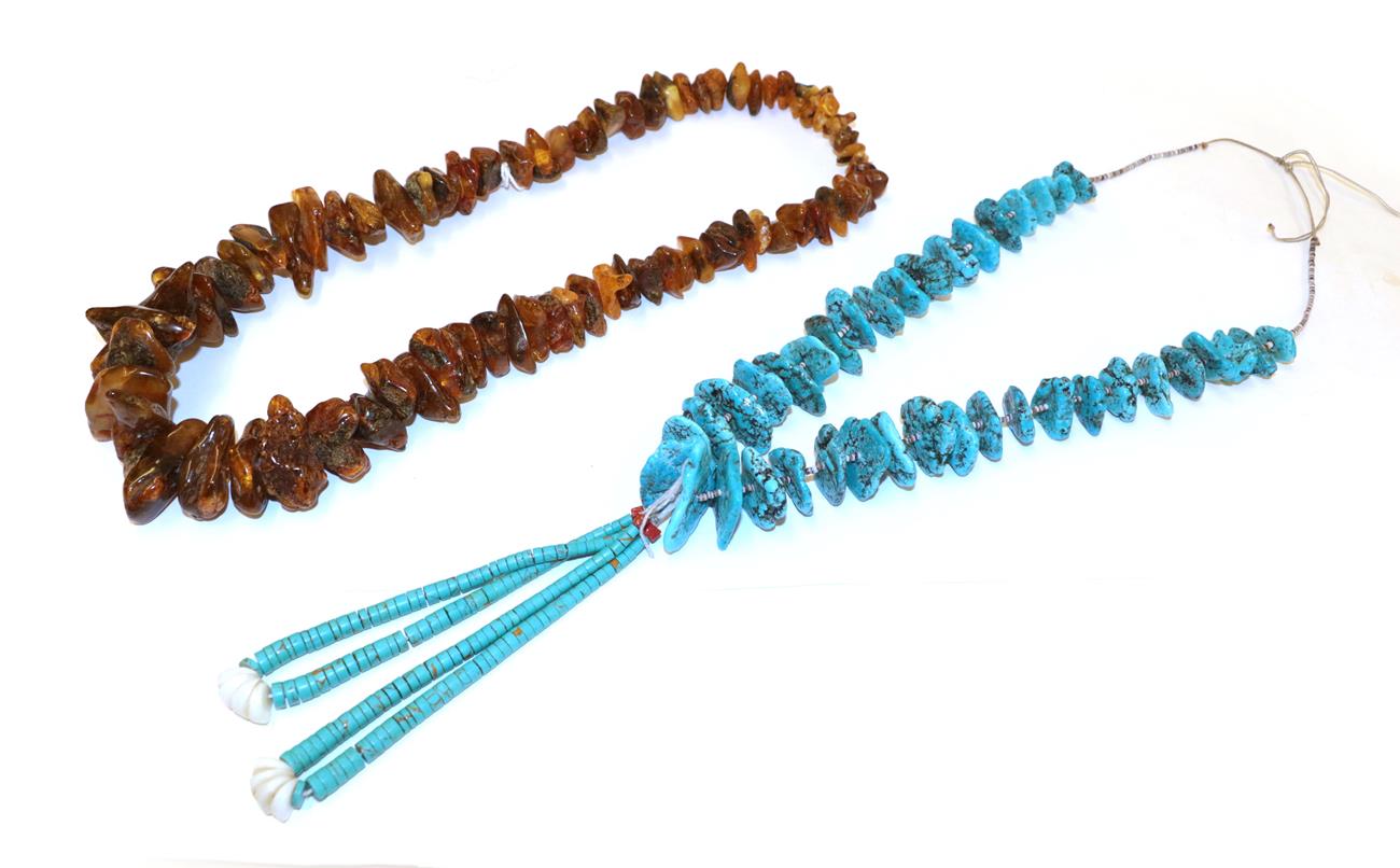 Lot 19 - An amber necklace, the irregular shaped graduated amber beads as a continuous strand, length...