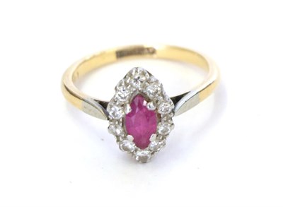 Lot 29 - A ruby and diamond cluster ring, the marquise cut ruby within a border of eight-cut diamonds in...