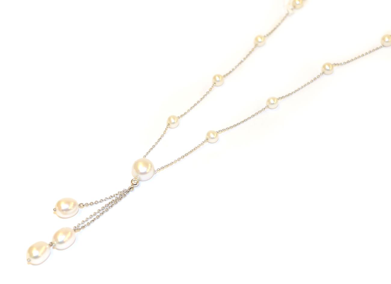 Lot 32 - An 18 carat white gold cultured pearl and diamond necklace, the trace link chain interspaced...