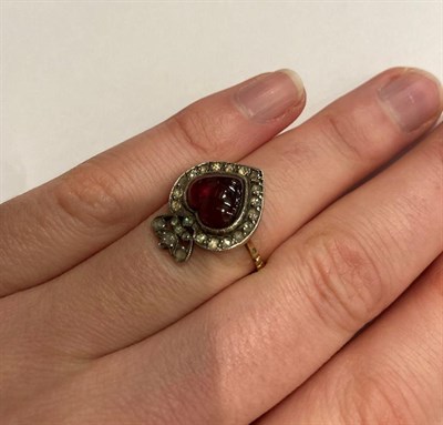 Lot 33 - A Victorian garnet and diamond cluster ring, of heart shape design, the heart shaped cahochon...