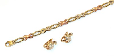 Lot 37 - A 9 carat tri-colour gold fancy link bracelet, plain polished oval links alternate with plain...