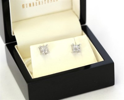 Lot 40 - A pair of diamond cluster earrings, four princess cut diamonds in white claw settings, total...
