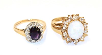 Lot 46 - A 9 carat gold amethyst and diamond cluster ring, the oval cut amethyst within a border of...