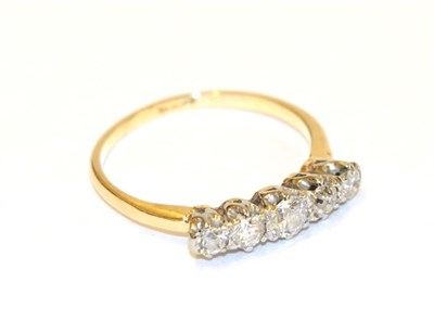 Lot 51 - A diamond five stone ring, the graduated round brilliant cut diamonds in white claw settings,...