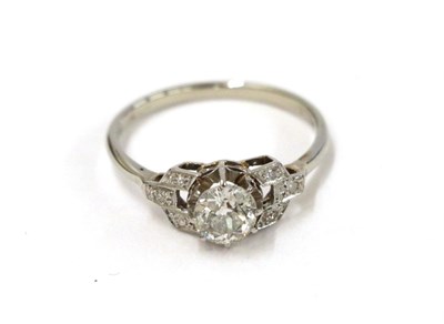Lot 53 - A diamond solitaire ring, the old cut diamond in a white claw setting, to eight-cut diamond set...