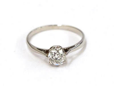 Lot 54 - A diamond solitaire ring, the old cut diamond in a white claw setting, to a tapered shoulder...